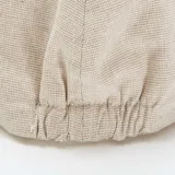 Boina estilo irlandés en color beige, confeccionada en una mezcla de algodón y lino con textura sutil.