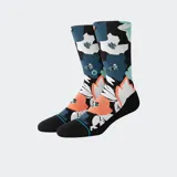 Medias Stance con estampado floral en tonos naranja, blanco, azul y celeste sobre fondo negro. Caña alta y puntera reforzada en negro con detalle de línea celeste.