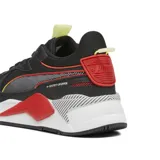 Championes Puma RS-X-3D negros con detalles en rojo, amarillo y blanco. Confeccionados en mesh y material sintético, con entresuela de PU y suela de goma.