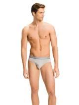 Pack de tres calzoncillos tipo slip de algodón elástico blanco con cintura elástica con logo Tommy Hilfiger.