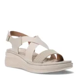 Sandalias de plataforma con tiras cruzadas elásticas y tira frontal con textura geométrica. Cuenta con ajuste de velcro en el talón y suela ergonómica.