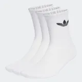 Pack de tres pares de medias Adidas Trefoil Cushion Crew, color blanco, con el logo del trifolio en negro en el tobillo y la frase "WITH THE 3 STRIPES" en la parte superior.
