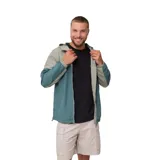 Campera cortavientos Rusty modelo Aidan, con diseño de bloques de color en tonos verde y gris. Presenta capucha, cierre frontal completo, puños elásticos y bolsillos laterales.