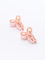 Set de dos pinzas para el pelo con forma de moño, color negro con borde transparente.