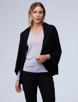Cardigan de tejido suave con frente abierto y mangas amplias de corte holgado.
