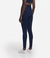 Calza legging deportiva de poliamida color azul con cintura alta de 10 cm.