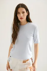 Remera manga 3/4 color celeste.