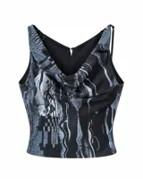 Top sin mangas de escote drapeado y corte relajado a la cintura. Es reversible, con un lado estampado abstracto en tonos negros, grises y azules con efecto glitch, y el otro lado en negro liso.