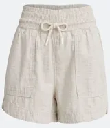 Short runner color beige, de cintura media con elástico y lazo ajustable. Confeccionado en algodón y lino, con bolsillos laterales.