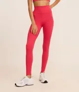Calza deportiva larga de microfibra color fucsia, con cintura alta y bolsillo lateral.