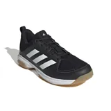 Championes deportivos Adidas Ligra 7, color negro con las tres tiras características en blanco. Presentan una suela de goma color caramelo con tecnología Adiwear para mayor durabilidad y tracción en superficies de interior.