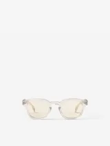 Lentes de sol Izipizi modelo Sun C, con montura transparente y lentes amarillas.