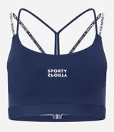 Top deportivo azul marino de poliamida con copa, breteles cruzados en la espalda con diseño de tiras elásticas blancas con lettering de texto impreso.