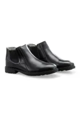 Botas de cuero color negro sin cordones, estilo Chelsea, con paneles elásticos laterales y suela dentada.