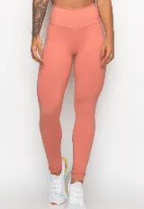 Calza larga de lycra color salmón con cintura alta.