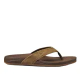 Ojotas Reef Cushion Spring color marrón con plantilla acolchada y tira de cuero sintético.