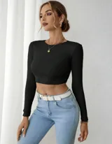 Top negro de lycra morley, manga larga, con espalda descubierta y nudo en la parte inferior.