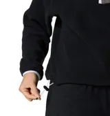 Polar de sherpa color negro Columbia, modelo Helvetia II Cropped, con cuello alto abotonado con broches, ribete en contraste y bolsillo frontal con cierre en el pecho.