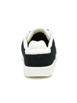 Championes Caterpillar modelo Pause Retro T-Toe, de color negro con suela blanca y detalles en dorado. Confeccionados en gamuza con cordones negros y suela de goma.
