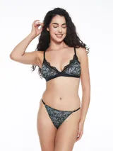 Colaless estampada con motivos abstractos en tonos verde, gris y negro.