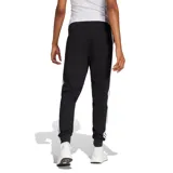 Pantalón de jogging Adidas Essentials Jogger W, color negro, con cintura ajustable con cordón y puños elásticos en los tobillos. Presenta el logo de Adidas en blanco en la pierna izquierda.