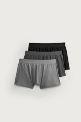 Pack de tres calzoncillos tipo bóxer de algodón elástico, con cintura elástica y costuras reforzadas. Incluye tonos negro, gris oscuro y gris claro.