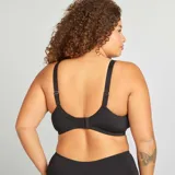Sujetador negro de cobertura completa, sin relleno, con copas de tul bordado y contorno de encaje.