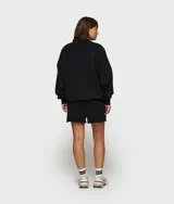 Suéter de felpa de algodón color blanco roto, de corte oversize y cuello redondo. Presenta un gran parche aplicado en el pecho con el número '10' en negro, con la palabra '10DAYS' verticalmente en el lado izquierdo del número.