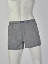 Boxer de tela con estampado a cuadros en tonos grises y blancos.