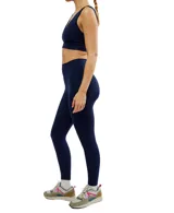 Calza deportiva de tiro alto con cintura contorneada, confeccionada en tejido técnico transpirable y elástico de cuatro direcciones.