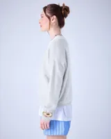 Suéter de cashmere cepillada con cuello en V, corte oversize, mangas largas y acabados acanalados.