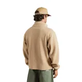 Buzo de polar tipo sherpa en color beige, con cierre frontal parcial y una franja horizontal de color marrón en el pecho. Presenta cuello alto, mangas largas con puños elásticos y un diseño holgado.