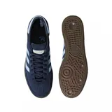 Championes Adidas Handball Spezial azul marino con detalles en celeste y suela de goma marrón.