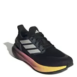 Championes de running Adidas modelo Pure Boost 5, con parte superior de malla técnica negra y mediasuela con tecnología de amortiguación degradada en tonos amarillo, naranja y violeta. Presentan las icónicas tres bandas laterales en color plateado y suela Adiwear de alta tracción.