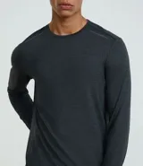 Remera deportiva de manga larga Get Over color gris melange, con cuello redondo y confeccionada en tejido tecnológico de secado rápido.