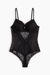 Body de encaje y malla color negro, con soutien push-up, breteles ajustables y diseño colaless.