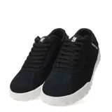 Championes urbanos Caterpillar modelo Hex +, color negro con suela blanca de diseño hexagonal. Confeccionados en gamuza, cuentan con cierre de cordones y logo de la marca en el lateral y la lengüeta.