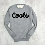 Buzo gris claro melange de algodón con felpa y estampa "Cools" en el pecho.