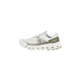 Championes de trail running On Running modelo Cloudvista 2, en color blanco con detalles en verde oliva. Presentan capellada de malla transpirable, cordones tradicionales y suela con tecnología CloudTec para mayor amortiguación.