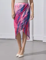 Falda midi cruzada de microtul estampado en tonos rosa, fucsia, celeste y azul. Pretina ancha elastizada y forro interno a tono. Marca Cable & Gauge.