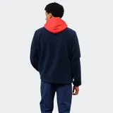 Campera de polar azul marino con capucha, cierre frontal y detalles en rojo. Presenta mangas con paneles blancos, logo de Umbro bordado y escudo del Club Nacional de Football.