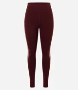 Pantalón legging deportivo Get Over de color bordó, confeccionado en microfibra elastizada con cintura alta y una línea vertical en contraste en el lateral.