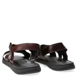 Sandalias de cuero negro con diseño de tiras cruzadas y ajuste mediante velcro en el talón. Presentan una plantilla texturizada y suela de goma antideslizante.