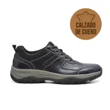 Zapato casual de cuero negro con cordones, suela de goma gris y detalles de costuras.
