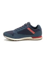 Championes Caterpillar modelo Ventura, de diseño urbano y casual. Confeccionados en una combinación de gamuza y malla técnica en color azul, con detalles en rojo y beige en la entresuela. Presentan el logo de la marca en el lateral y la lengüeta, con suela de goma para mayor tracción.