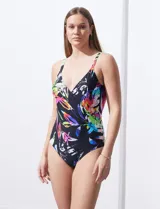 Malla enteriza negra con estampado de hojas de colores, escote en V cruzado y breteles regulables.