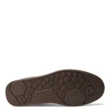 Championes urbanos Caterpillar modelo Pause Retro Canvas, con diseño de inspiración retro. Presentan una capellada que combina lona resistente y gamuza en tonos negro y gris, con suela de goma color marrón con textura hexagonal y logo de la marca en el lateral y la suela.