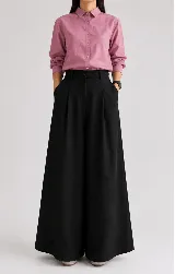 Pantalón wide leg de lino negro, con tiro alto y pinzas frontales.