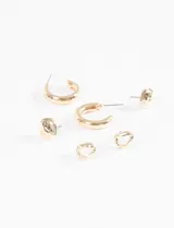 Set de tres pares de caravanas doradas: un par de aros pequeños con forma de nudo, un par de aros tipo argolla y un par de caravanas con forma de gota.