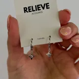 Aros de plata 925 con forma de argolla y dije colgante en forma de estrella con circonia.